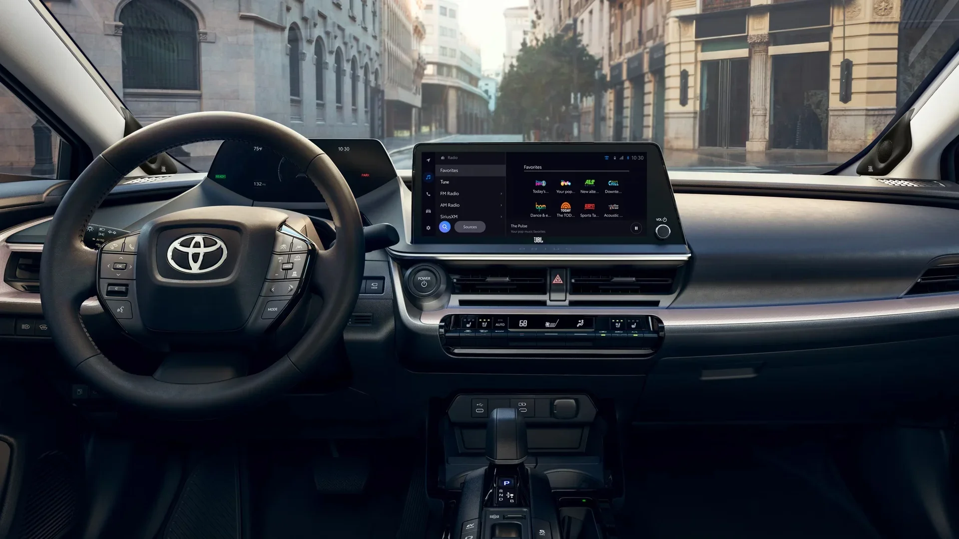 Interior view of a Toyota Prius showing the large infotainment screen and dashboard